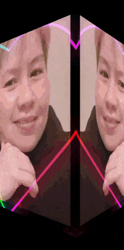 a woman 's face is reflected in a cube with a heart in the middle