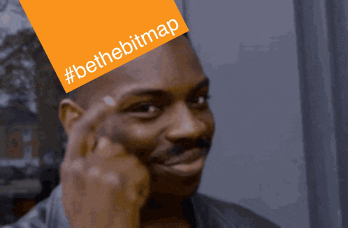 a man wearing a hat with #bethebitmap on it