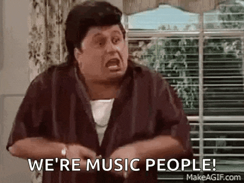 a man is screaming and saying `` we 're music people ! '' in front of a window .