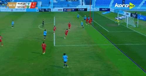 a soccer game is being played in a stadium and the score is 1 to 1