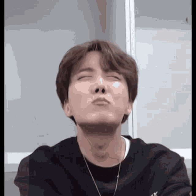 a close up of a person making a funny face .