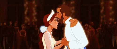 a man and a woman are dancing together in a dark room .