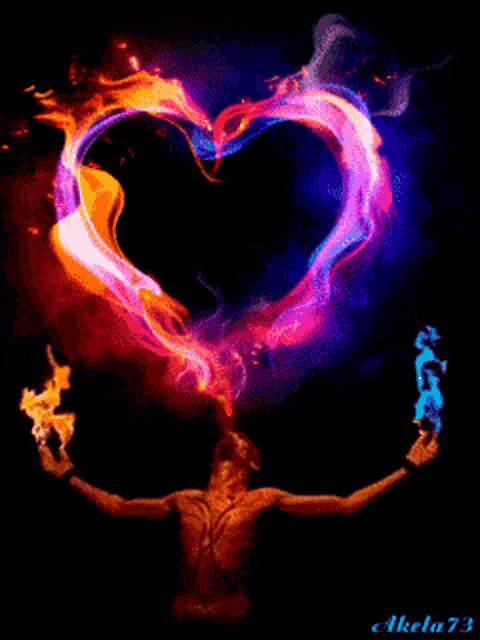 a man is holding flames in his hands in front of a heart made of flames