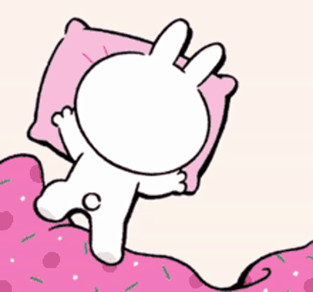 a cartoon of a bunny laying on a bed with a pink pillow