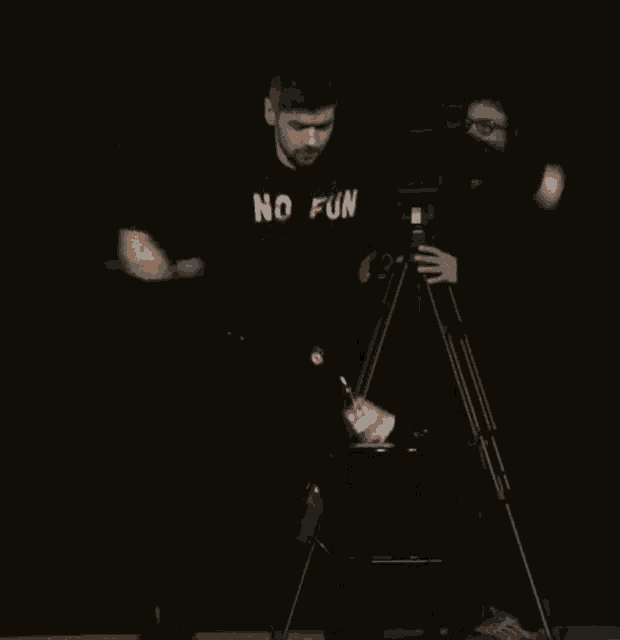 a man wearing a no fun sweatshirt is dancing