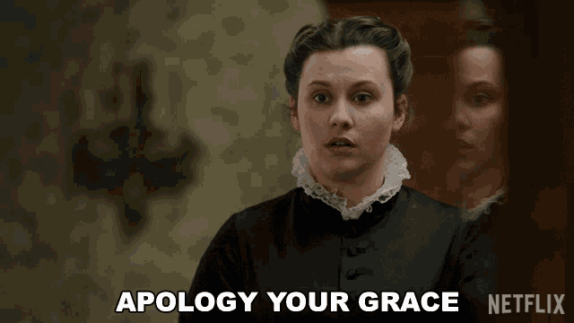 a woman says apology your grace in front of a mirror