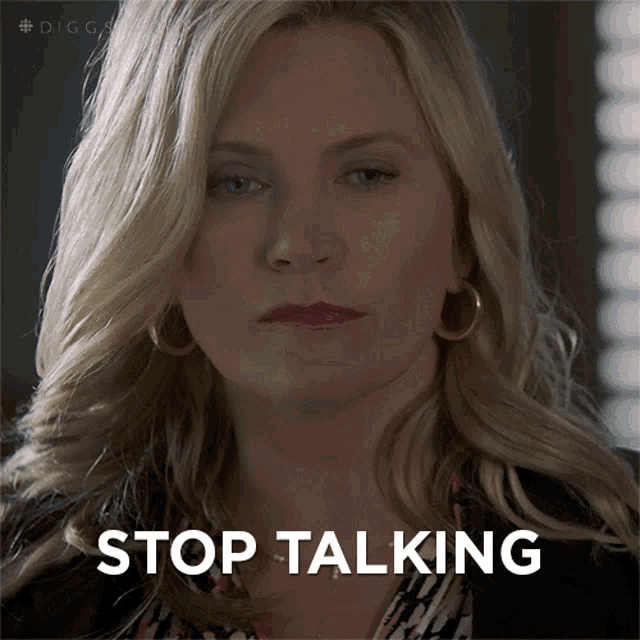 a close up of a woman 's face with the words stop talking written below her