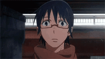 a close up of a person wearing glasses and a scarf looking up .