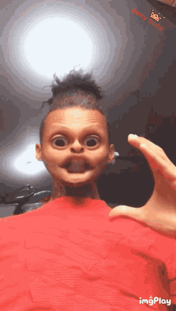 a person in a red shirt is making a funny face with a betty boop sticker