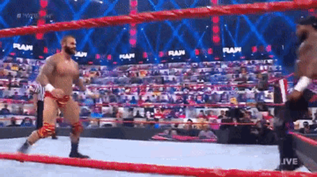 a man in a wrestling ring with the word raw written on it