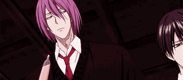 a man with purple hair and a red tie stands next to another man