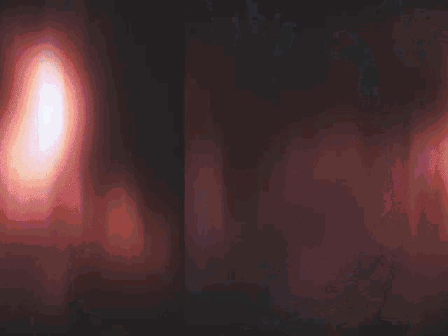 a painting of a demon with glowing orange eyes