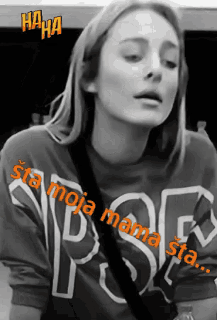 a woman wearing a shirt that says " sta moja mama star "