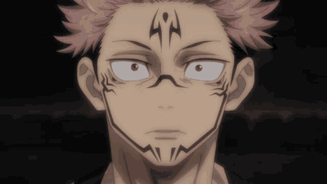 a close up of a person 's face with a tattoo on his forehead