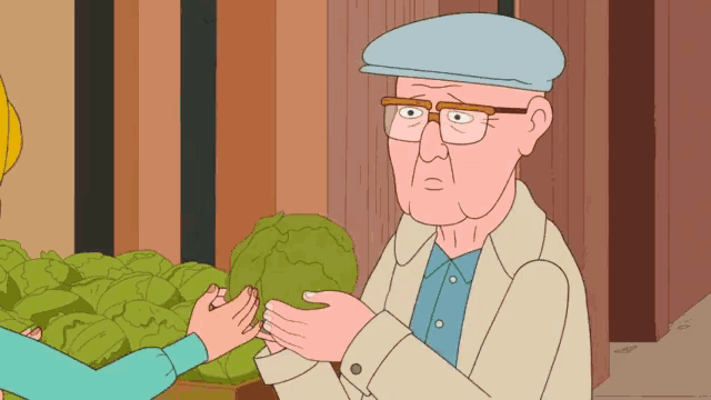 a man with glasses and a hat is talking to a woman who is holding a cabbage