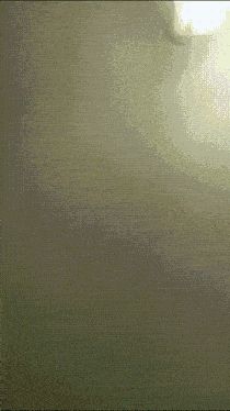 a light is shining on a wall with a grid pattern