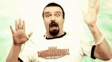 a man with a beard wearing a shirt that says dukes of hazzard on it