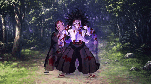 a couple of monsters standing next to each other in the woods