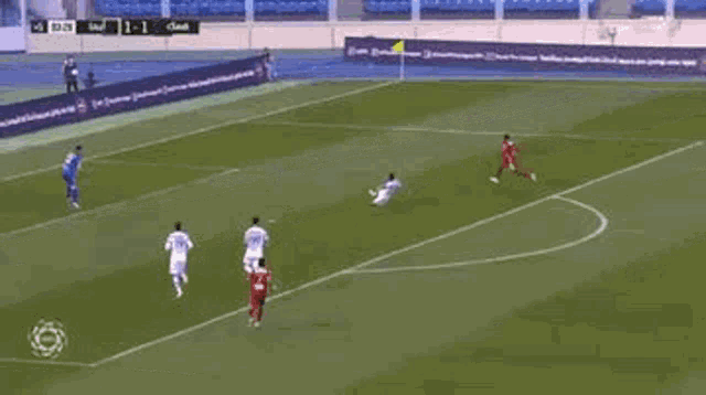 a group of soccer players are playing a game of soccer on a field .