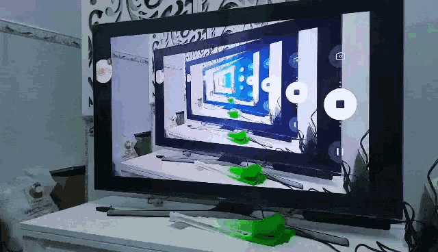 a samsung tv shows a picture of a room with a clock on the wall