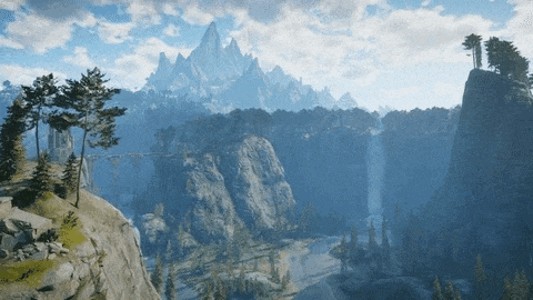 a view of a valley with mountains and trees