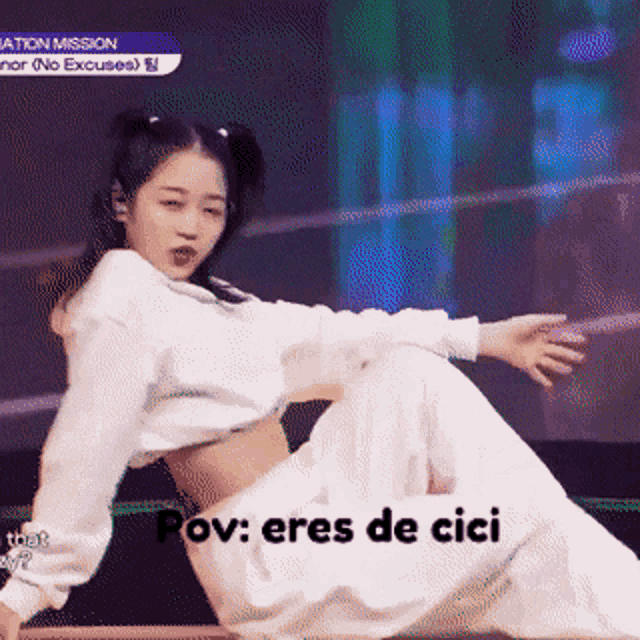 a girl in a white crop top is kneeling down with the words pov eres de cici written below her