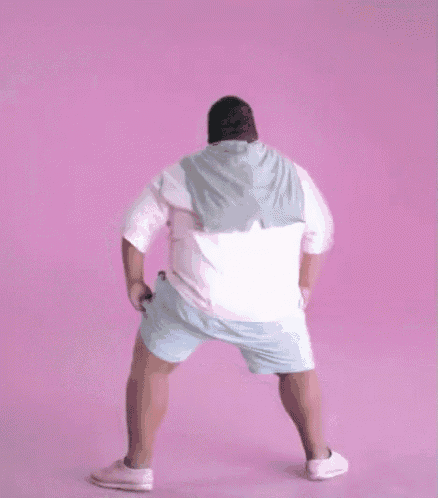 a fat man is dancing on a pink background .
