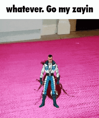 a toy superhero is standing on a pink rug and says whatever go my zayin .