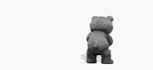 a teddy bear is standing in front of a white background holding a bottle .