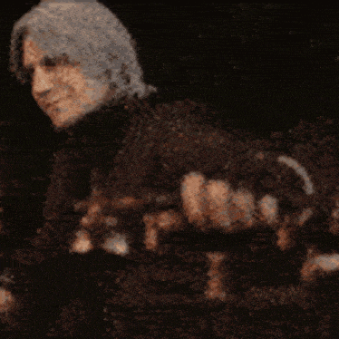 a close up of a person 's face with a blurred background