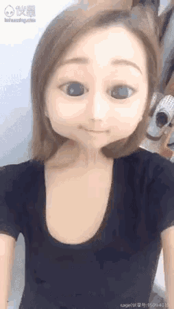 a woman in a black shirt with a cartoon face on her face .