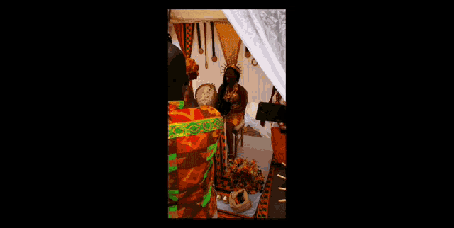 a man is taking a picture of a woman standing in front of a table that says mr & mrs.
