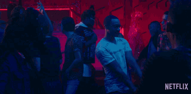 a netflix ad shows a man dancing in a crowd of people