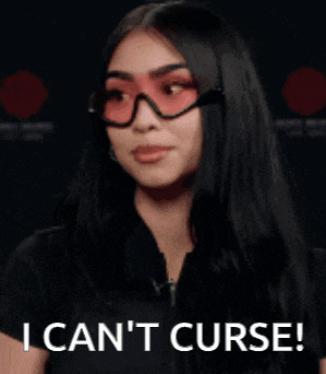 a woman wearing sunglasses and a black shirt is covering her mouth with her hands and says i can 't curse