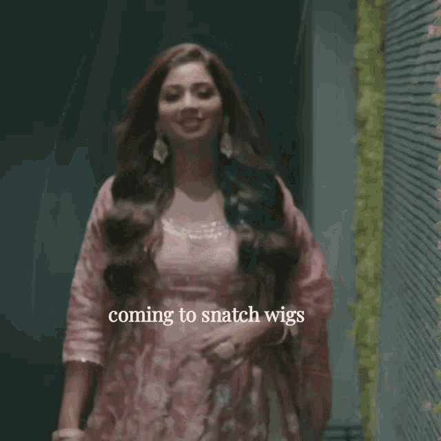 a woman in a pink dress with the words coming to snatch wigs