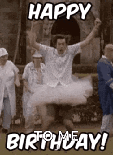 a man in a tutu is jumping in the air while a group of people are standing around him .