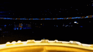 a boxing ring with a gold ring that says ' tna ' on it