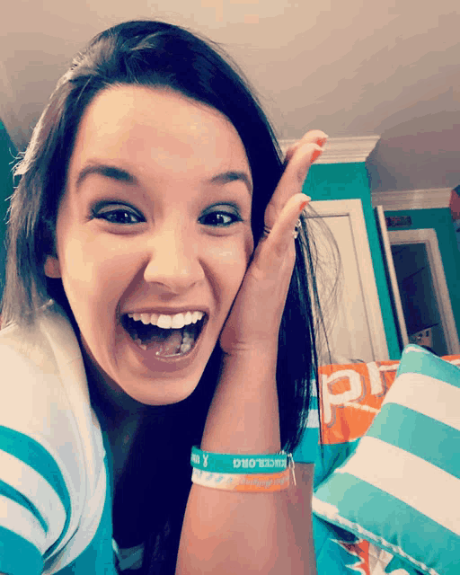 a girl wearing a bracelet that says ' i love you '