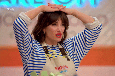a woman wearing a striped shirt and an apron that says magol