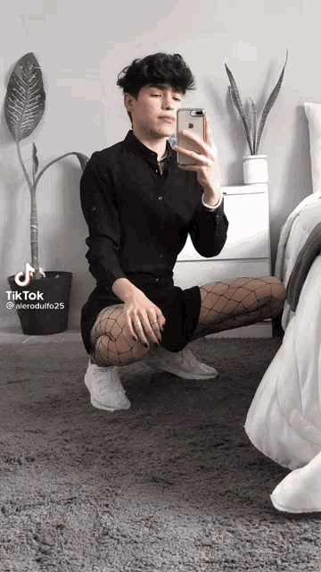 a person taking a selfie with a tiktok watermark on the bottom