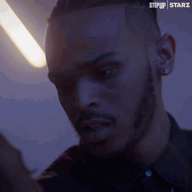 a close up of a man 's face with the words step up starz in the corner