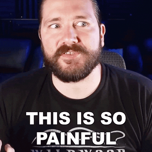 a man with a beard wears a shirt that says this is so painful