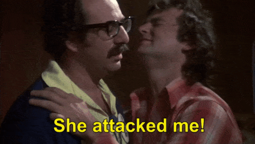 two men are standing next to each other and one of them is saying `` oh she came at me like an animal ! ''
