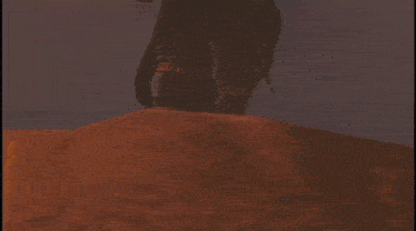 a statue of a man with a sword in his hand stands in the dark