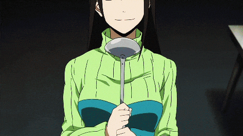 a woman in a green sweater holds a ladle in her hand