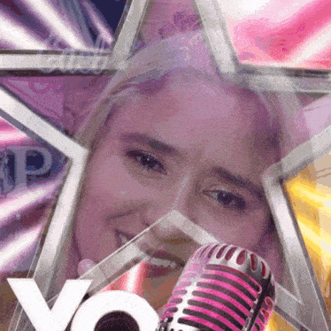 a woman singing into a microphone with a star in the background and the word yo on the bottom