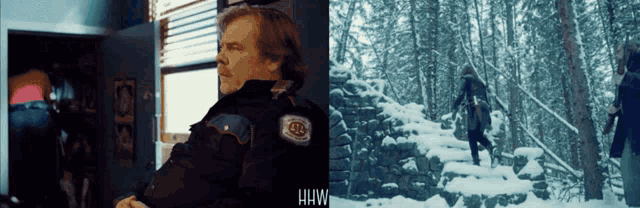 a man in a police uniform is standing in a room next to a snowy forest