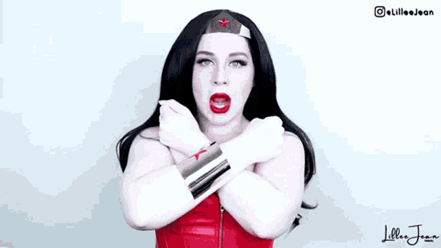 a woman in a wonder woman costume is wearing a red top