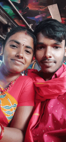 a man and woman are posing for a picture on a bus