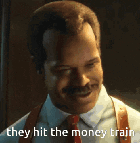 a man in a suit and tie with the words they hit the money train behind him